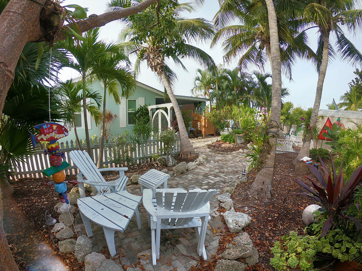 Palm and orchid Garden includes 2 person hammock, garden art, custom built Adirondack chairs, automatic lighting and shade